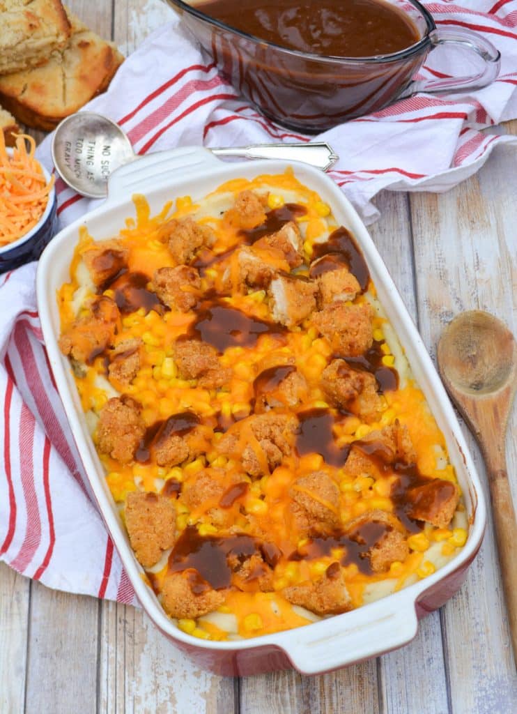 copycat kfc famous bowl casserole in a shallow red casserole dish