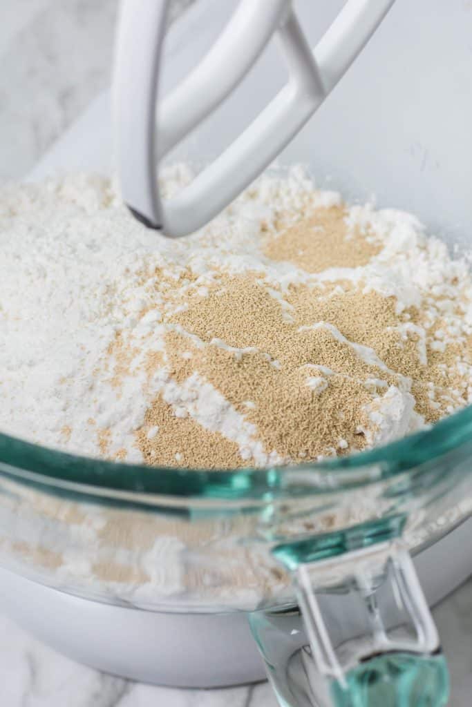 dry ingredients for making a batch of easy homemade english muffins in a glass mixing bowl