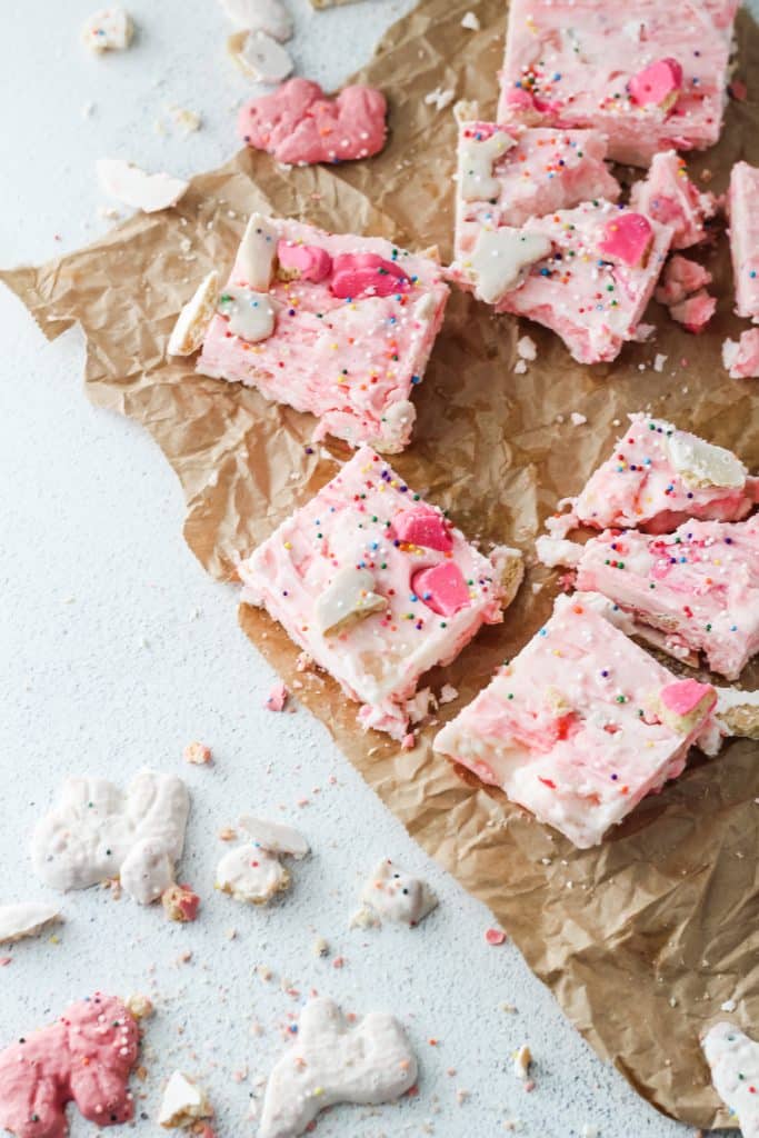 squares of circus cookie fudge on brown parchment paper