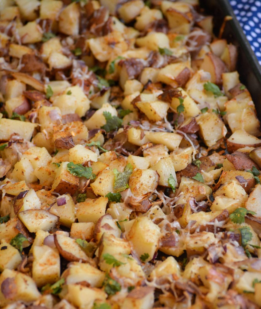 crispy old bay potatoes on a metal baking sheet