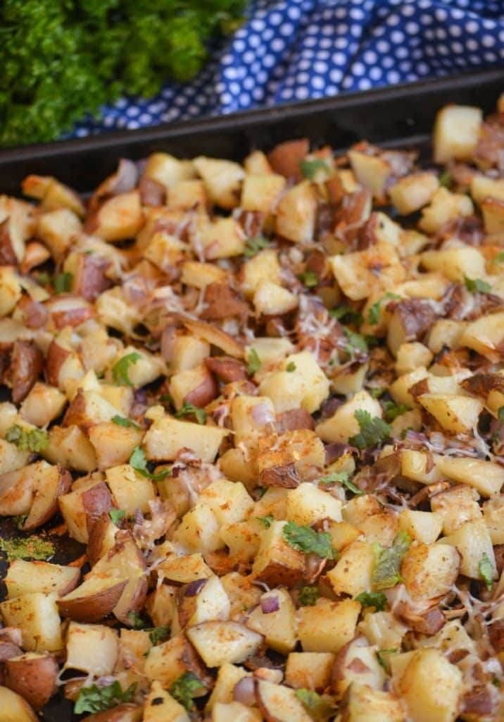 crispy old bay roasted potatoes on a metal baking sheet