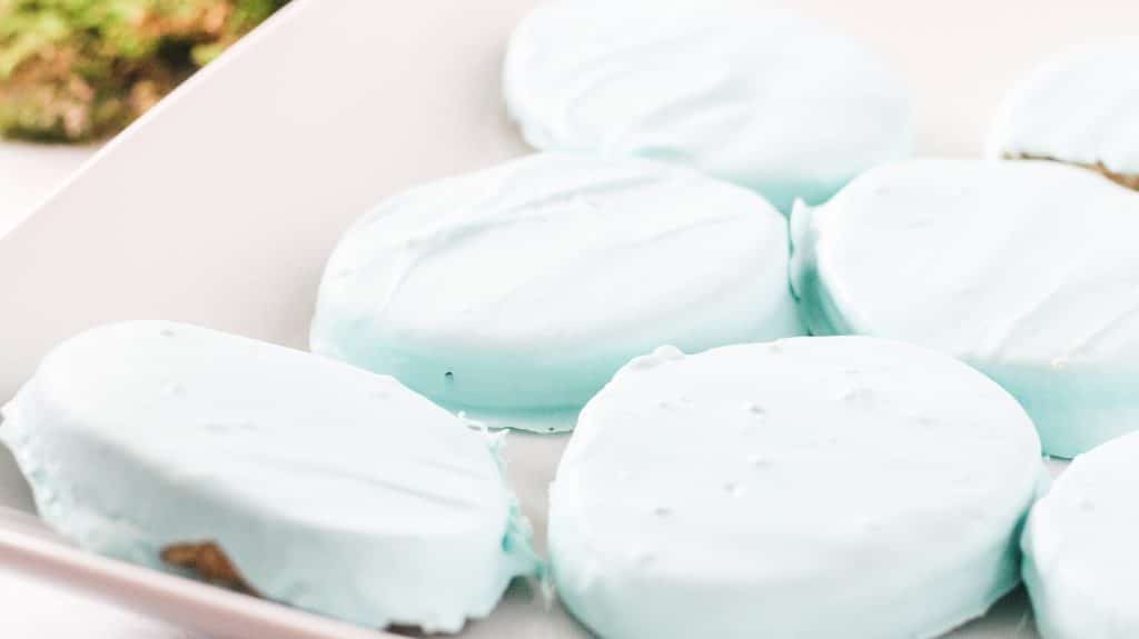 candy coated peanut butter eggs setting up on a white platter