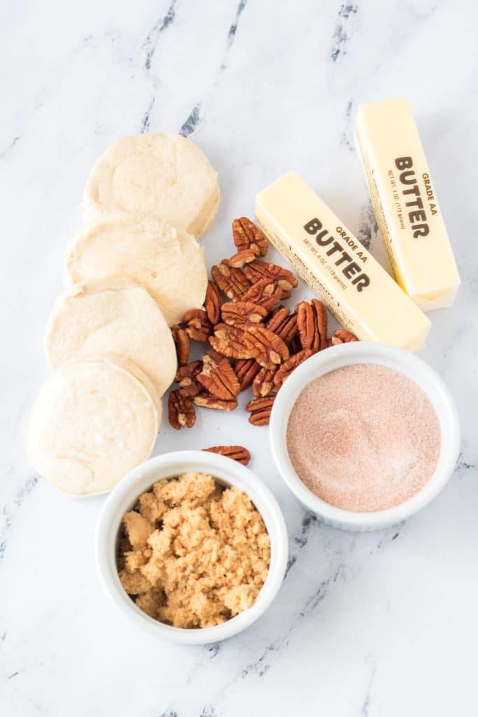 over head image showing the measured ingredients needed to make a batch of slow cooker sticky buns with pecans