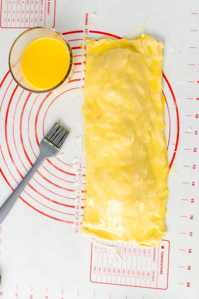 stuffed Greek puff pastry covered with a slick yellow egg wash