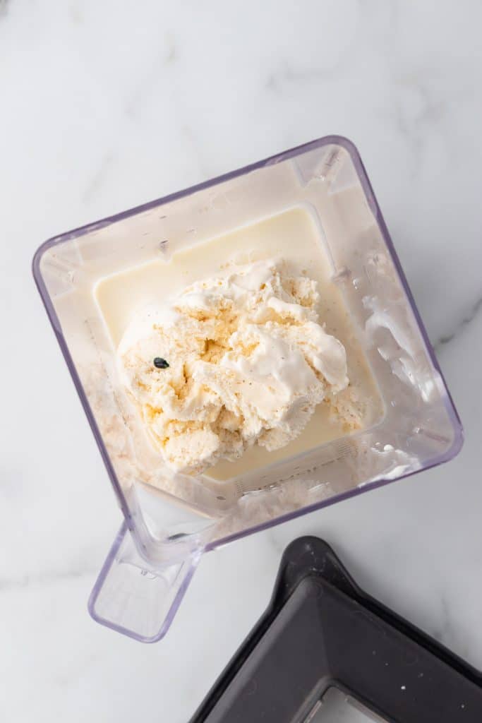 all of the ingredients needed for a copycat shamrock shake shown in a blentec blender