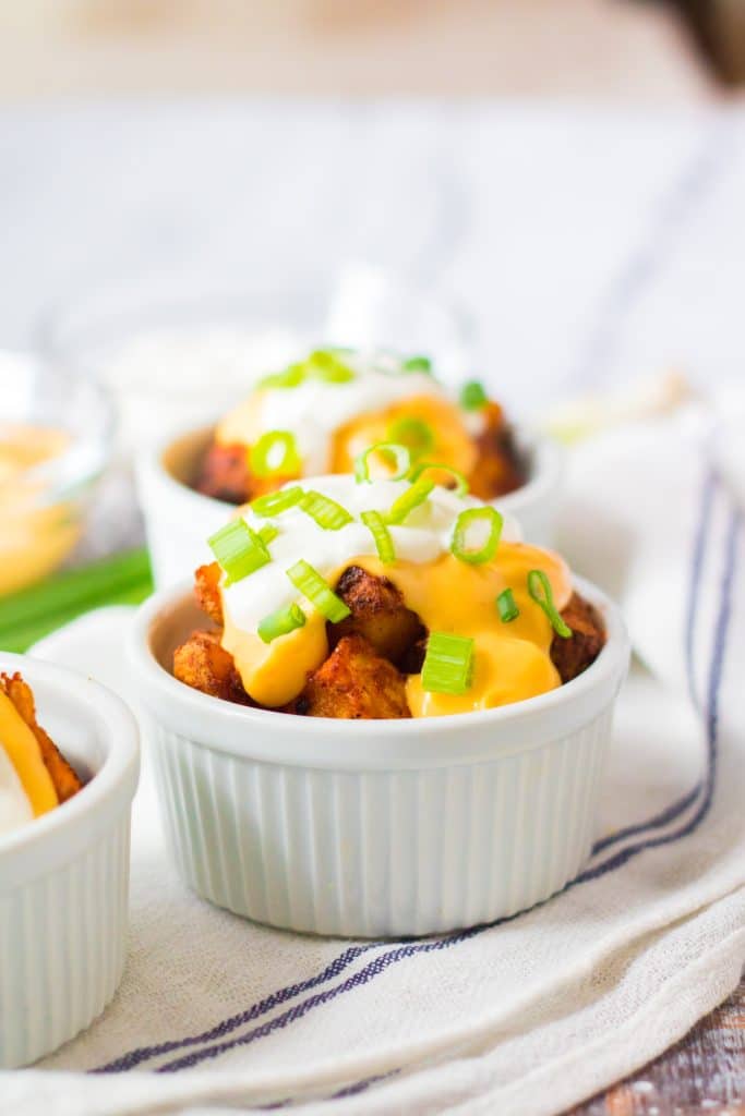 copycat taco bell cheesy fiesta potatoes in a white ramekin