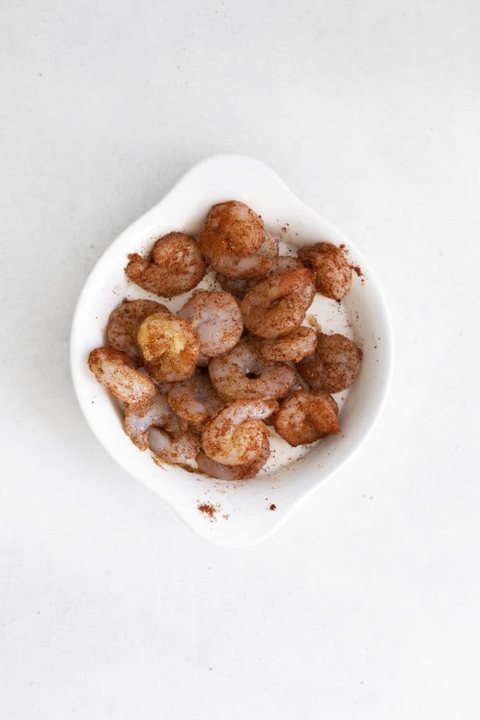 seasoned shrimp in a white bowl