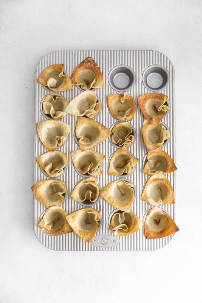 wonton cups in a silver muffin tin