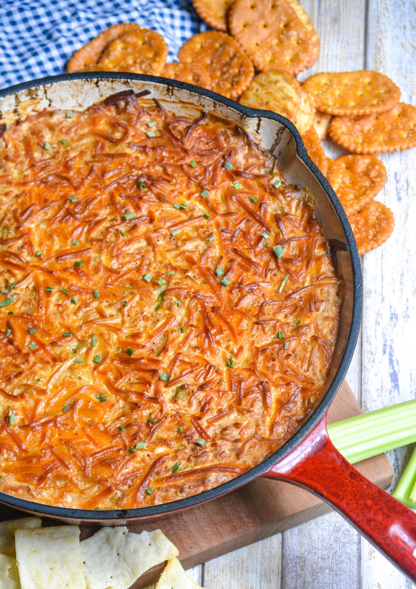 smoked crab dip in a red enameled cast iron skillet