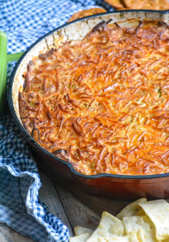smoked crab dip in a red enameled cast iron skillet