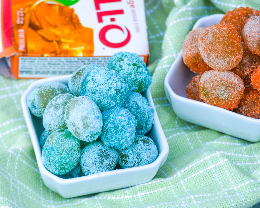 colorful candied grapes in two small white bowls