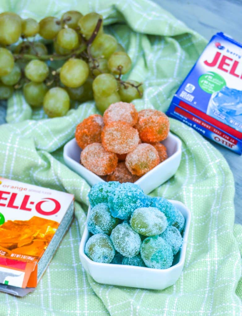colorful candied grapes in two small white bowls