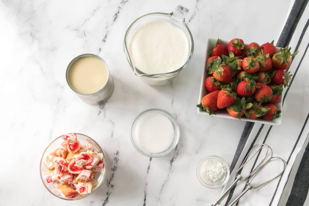 overhead image showing the measured ingredients needed for a batch of little debbie strawberry shortcake ice cream