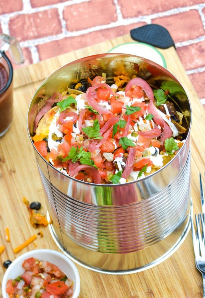 copycat Guy Fieri loaded nachos in a large metal tin can