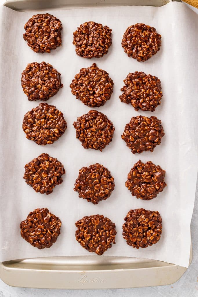 homemade star crunch cookies arranged in rows on a parchment paper lined baking sheet