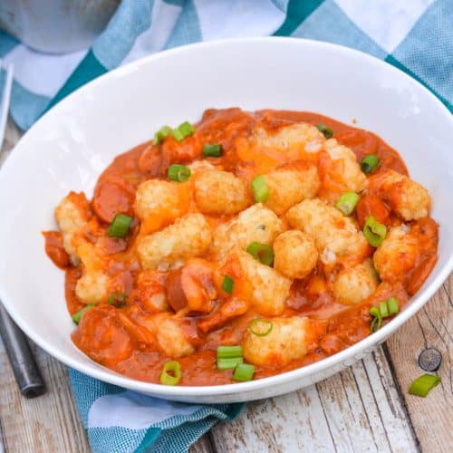 chili cheese dog tater tot casserole on a white bowl