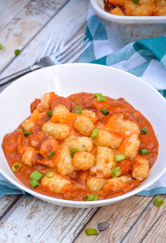 chili cheese dog tater tot casserole on a white bowl
