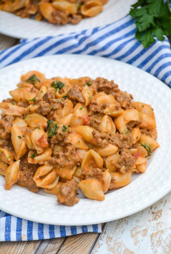 creamy boxed macaroni and cheese goulash on a white plate