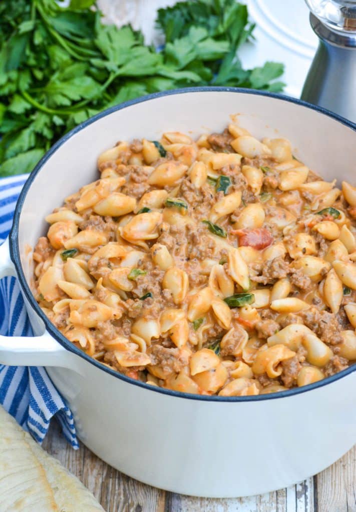 mac and cheese goulash in a white enameled dutch oven