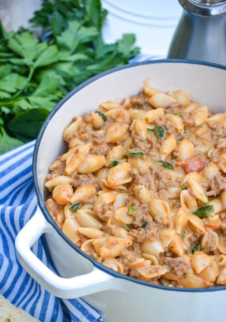 mac and cheese goulash in a white enameled dutch oven