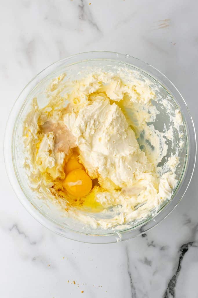 cheesecake filling in a glass mixing bowl