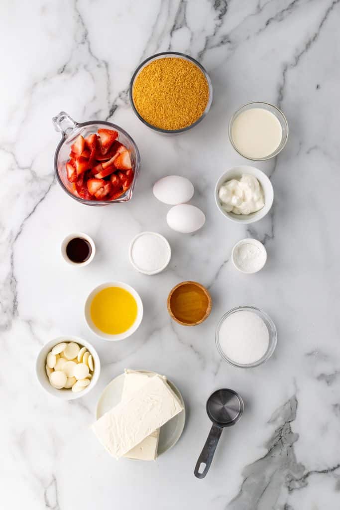 an overhead image showing the measured ingredients needed to make a batch of Philadelphia strawberry cheesecake snack bars