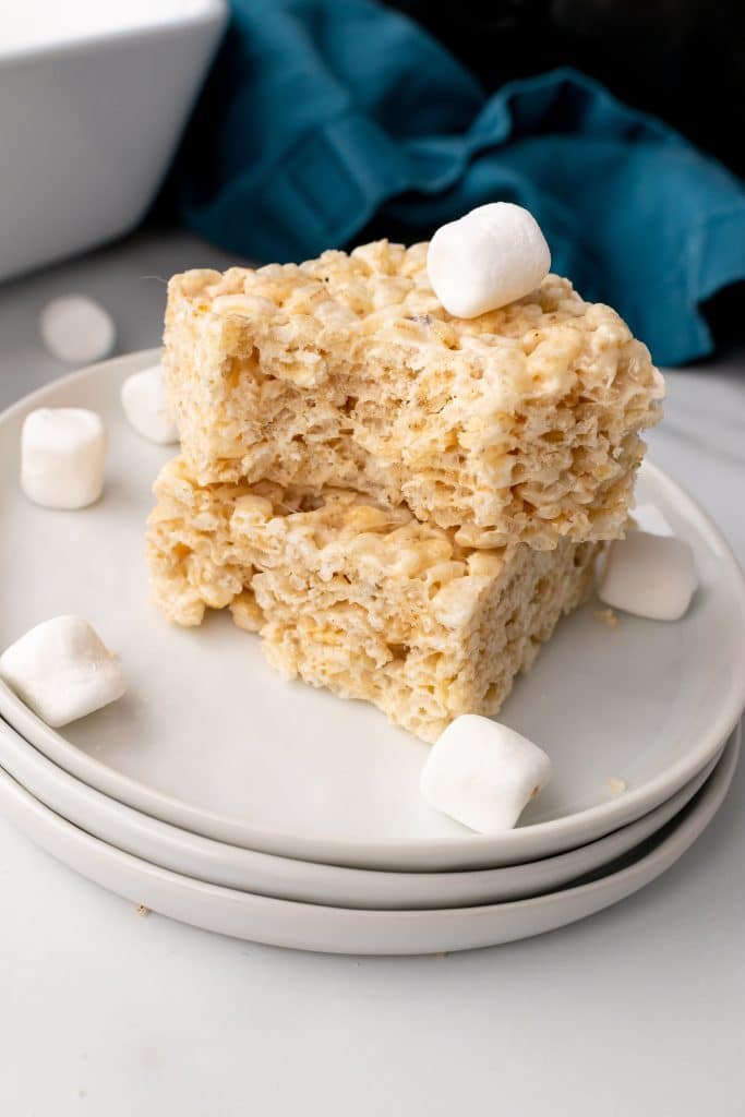 two crockpot rice krispie treats stacked together on a small white plate