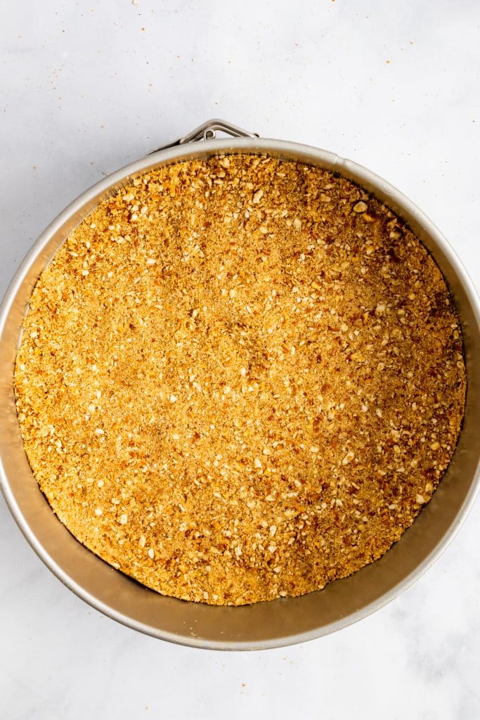pretzel crust pressed out in the bottom of a springform pan