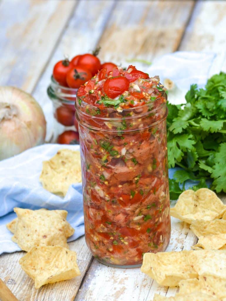 garden fresh tomato salsa in a tall glass jar