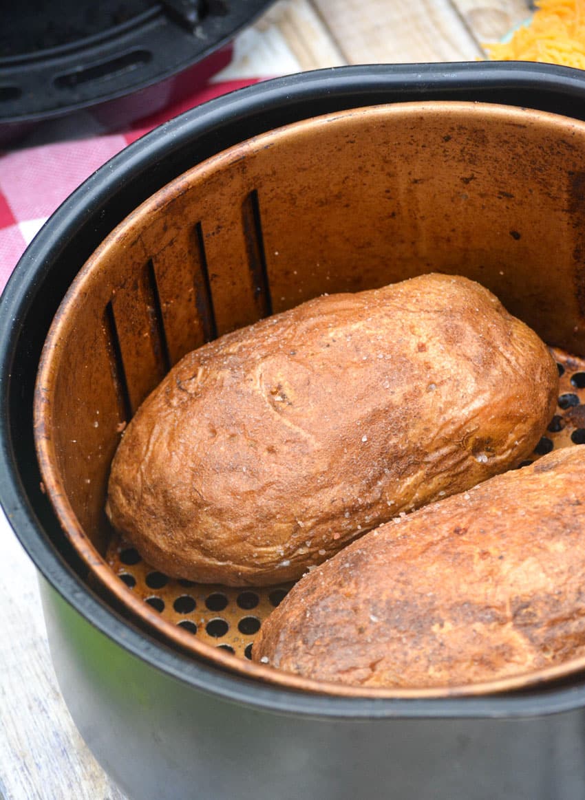 baked potatoes in an air fryer basket