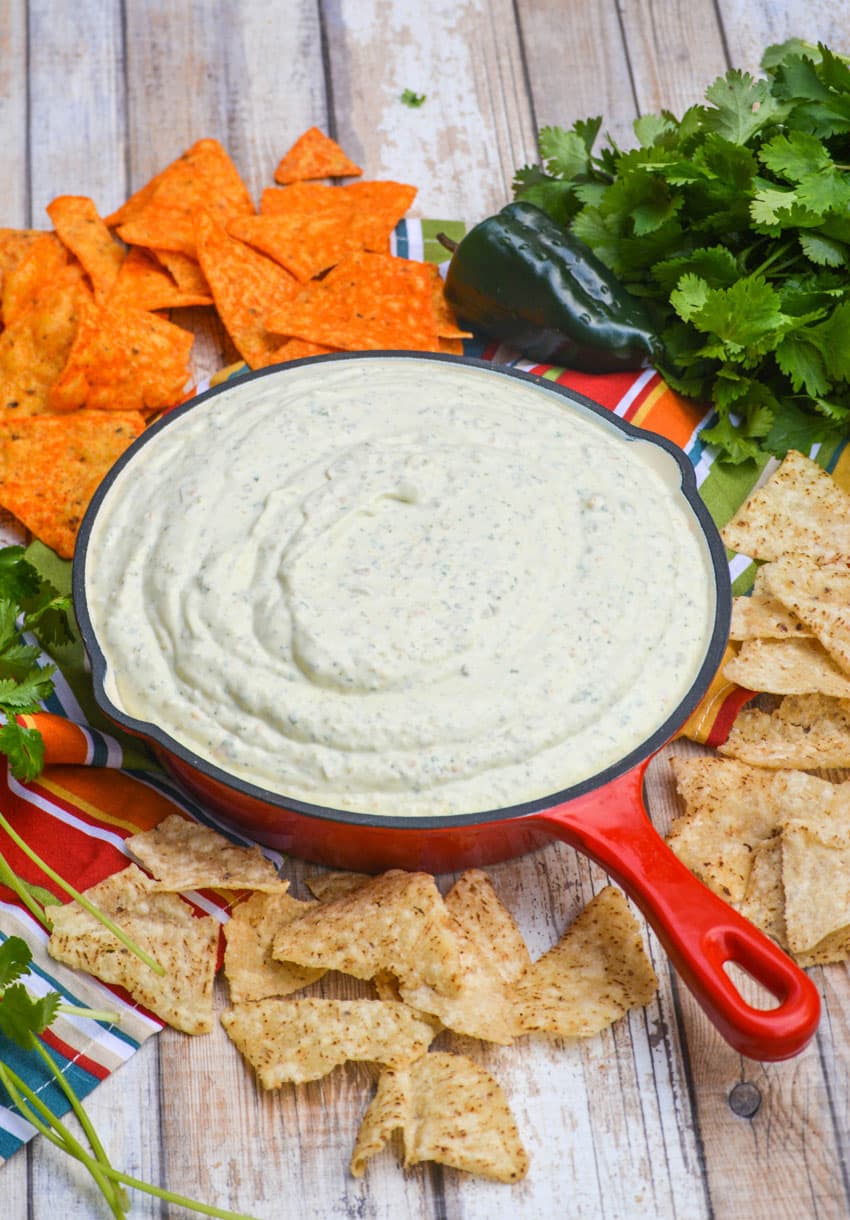 creamy jalapeno dip in a red enameled cast iron skillet