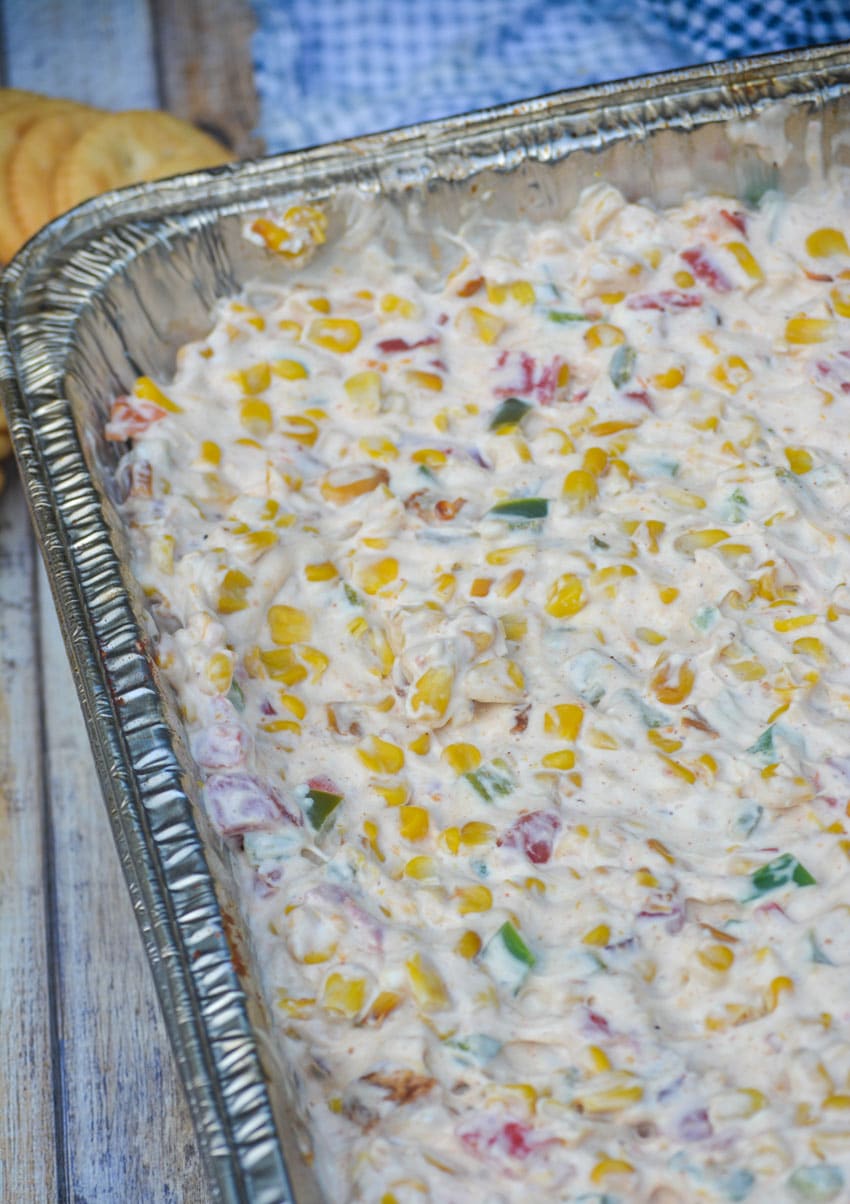 smoked cream corn dip in a disposable aluminum pan