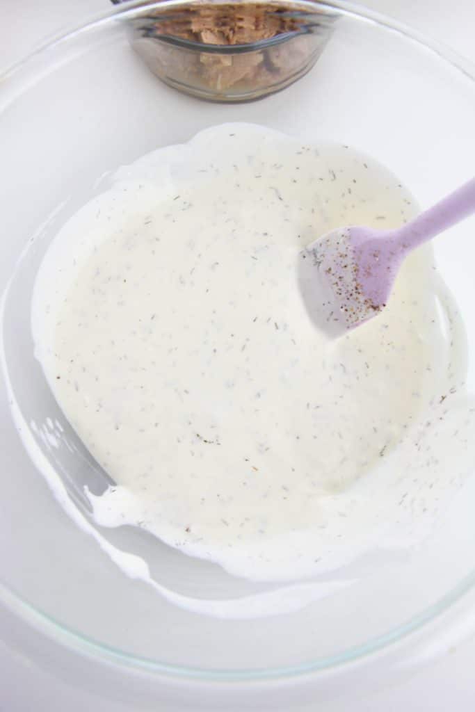 mayonnaise mixture in a glass mixing bowl