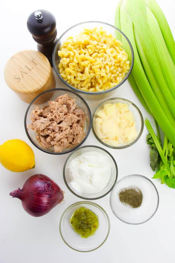 overhead ingredient shot showing the measured ingredients needed to make a batch of tuna macaroni salad