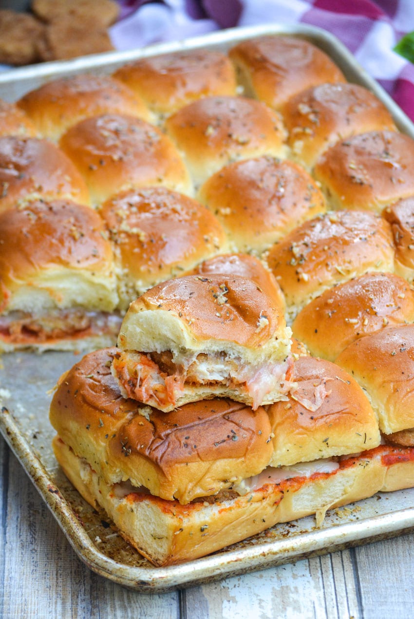 baked chicken parmesan nugget sliders on a silver baking sheet
