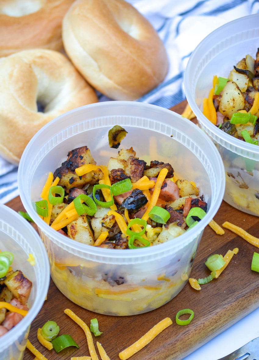 grab and go savory breakfast bowls on a wooden cutting board