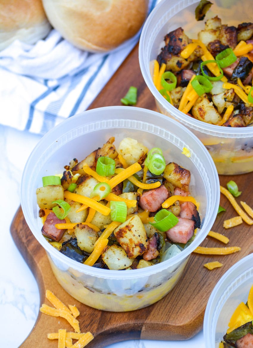 grab and go savory breakfast bowls on a wooden cutting board