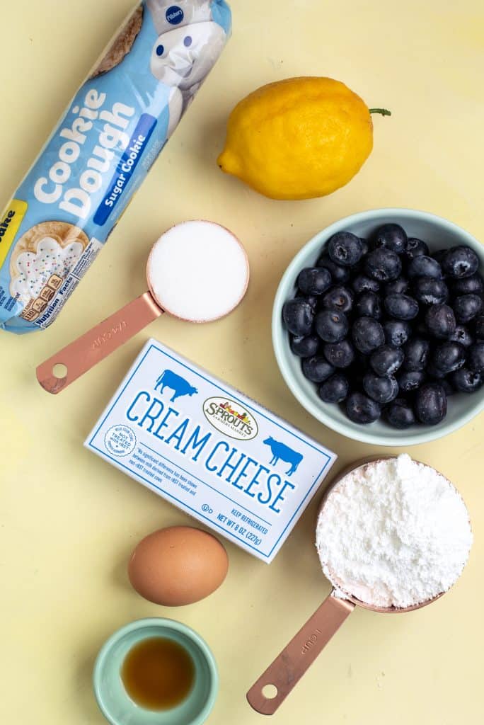 overhead image showing the measured ingredients needed to make a batch of blueberry sugar cookie bars