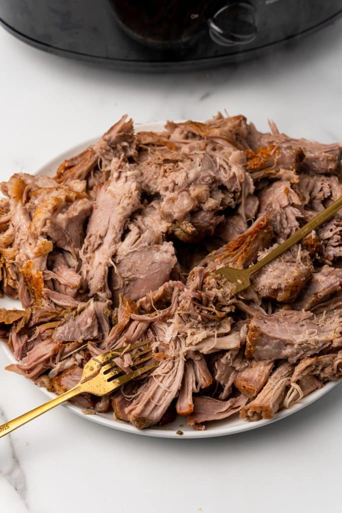 crockpot pulled pork on a white plate