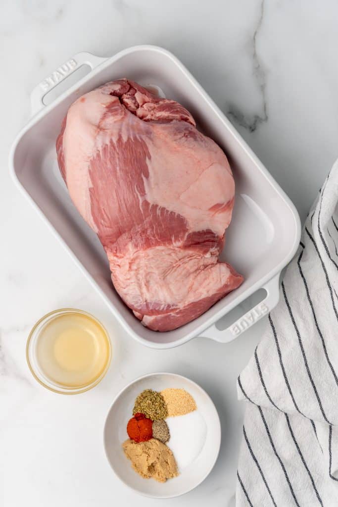 over head image showing the measured ingredients needed to make pulled pork in the slow cooker