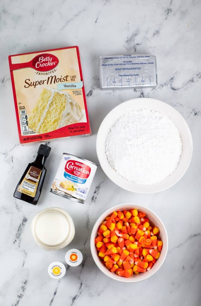 an overhead image showing the measure ingredients needed to make a candy corn poke cake
