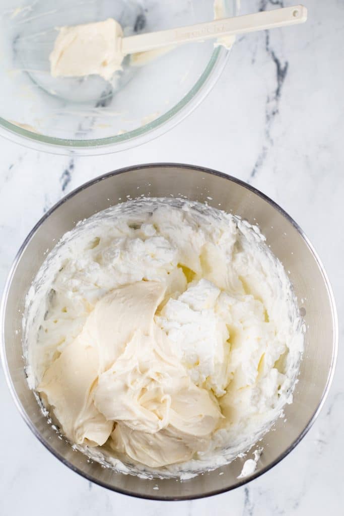 cream cheese frosting and whipped cream in a large mixing bowl