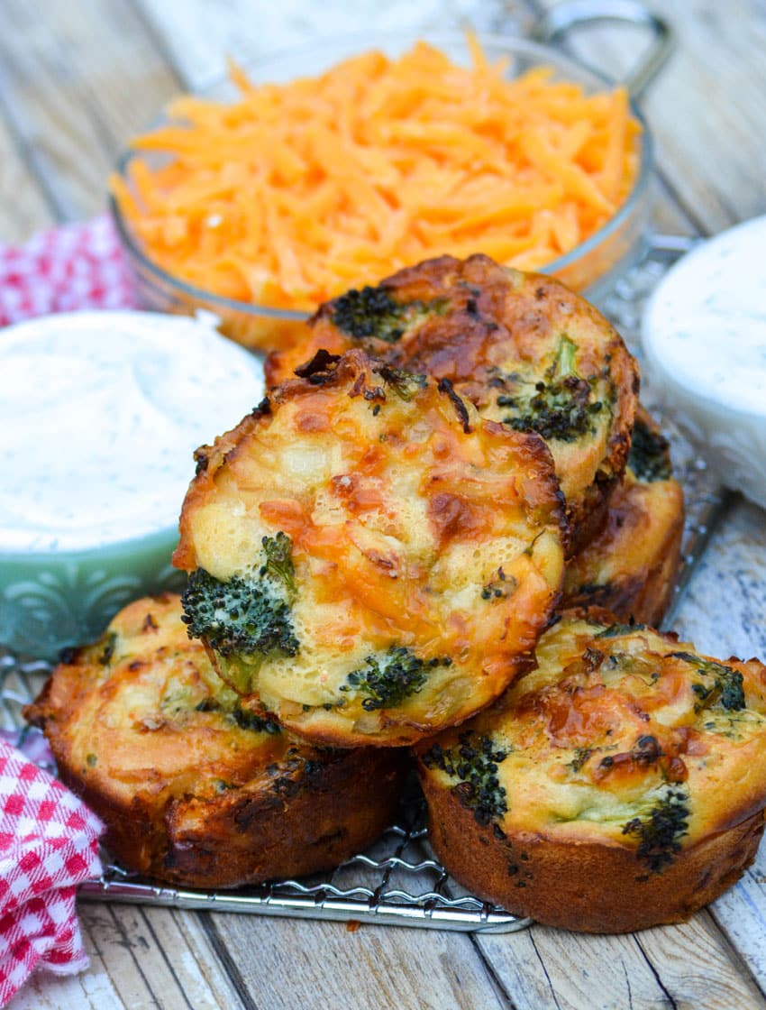 mini chicken broccoli and cheddar pies on a wire cooling rack