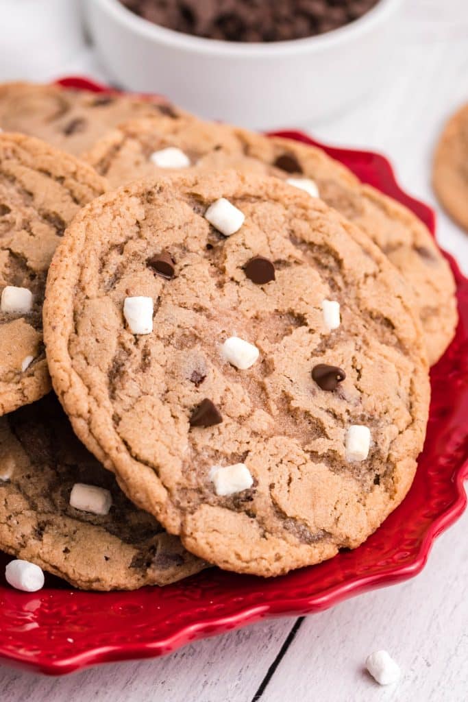 hot chocolate cookies piled on a red plate