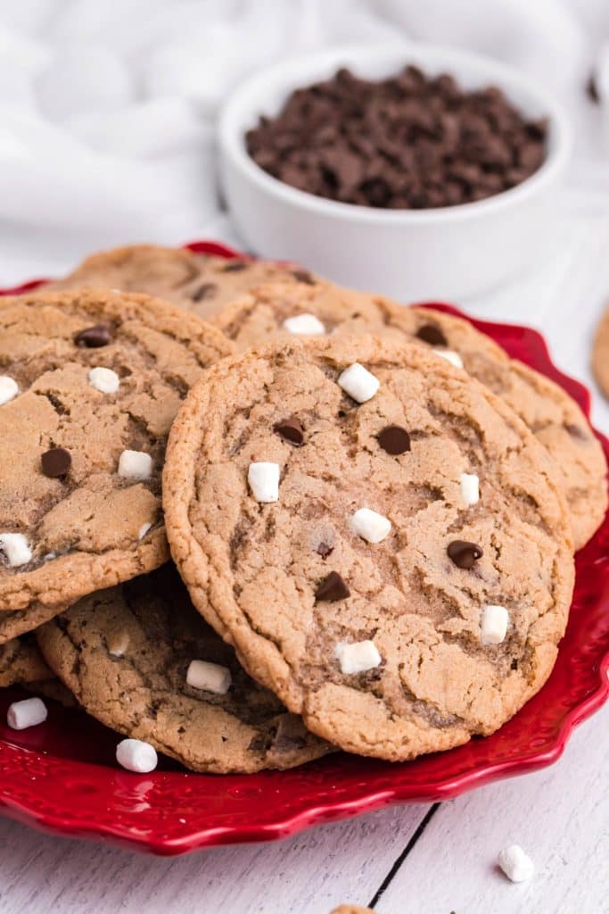 hot chocolate cookies piled on a red plate