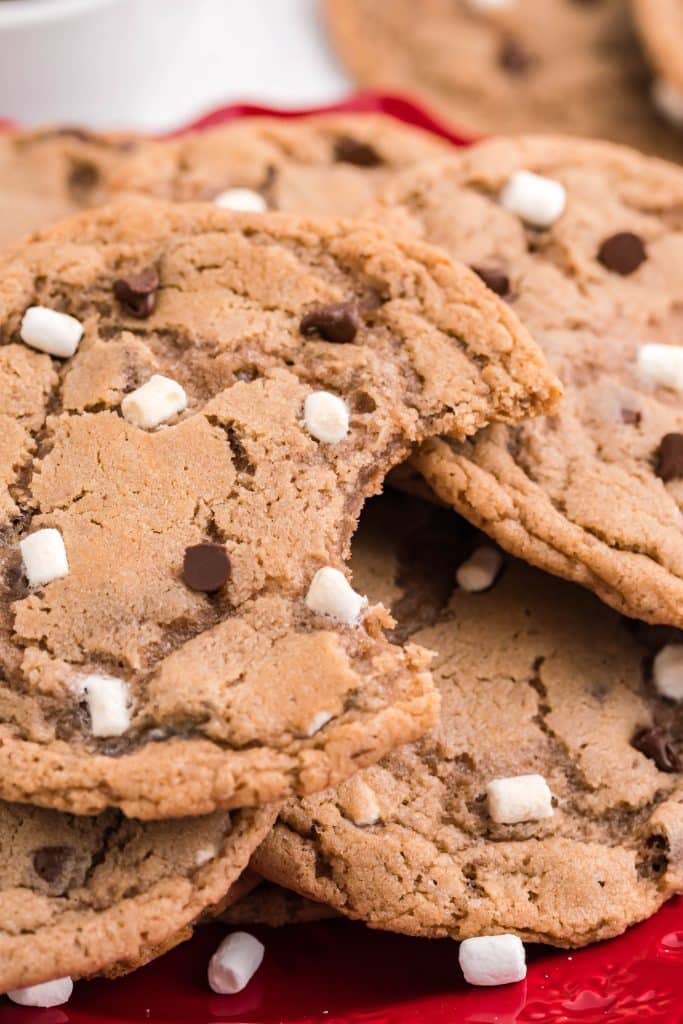 hot chocolate cookies piled on a red plate