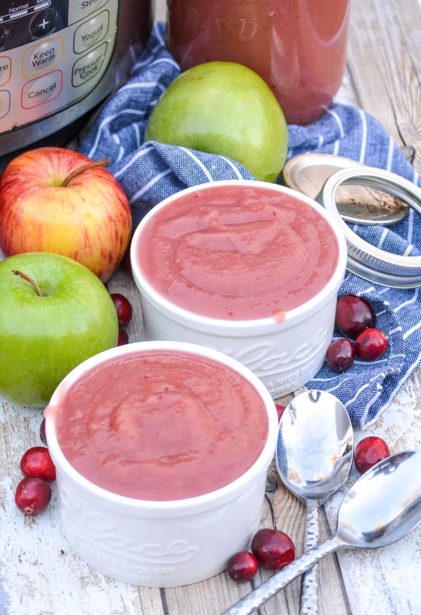 two white ramekins filled with instant pot cranberry applesauce