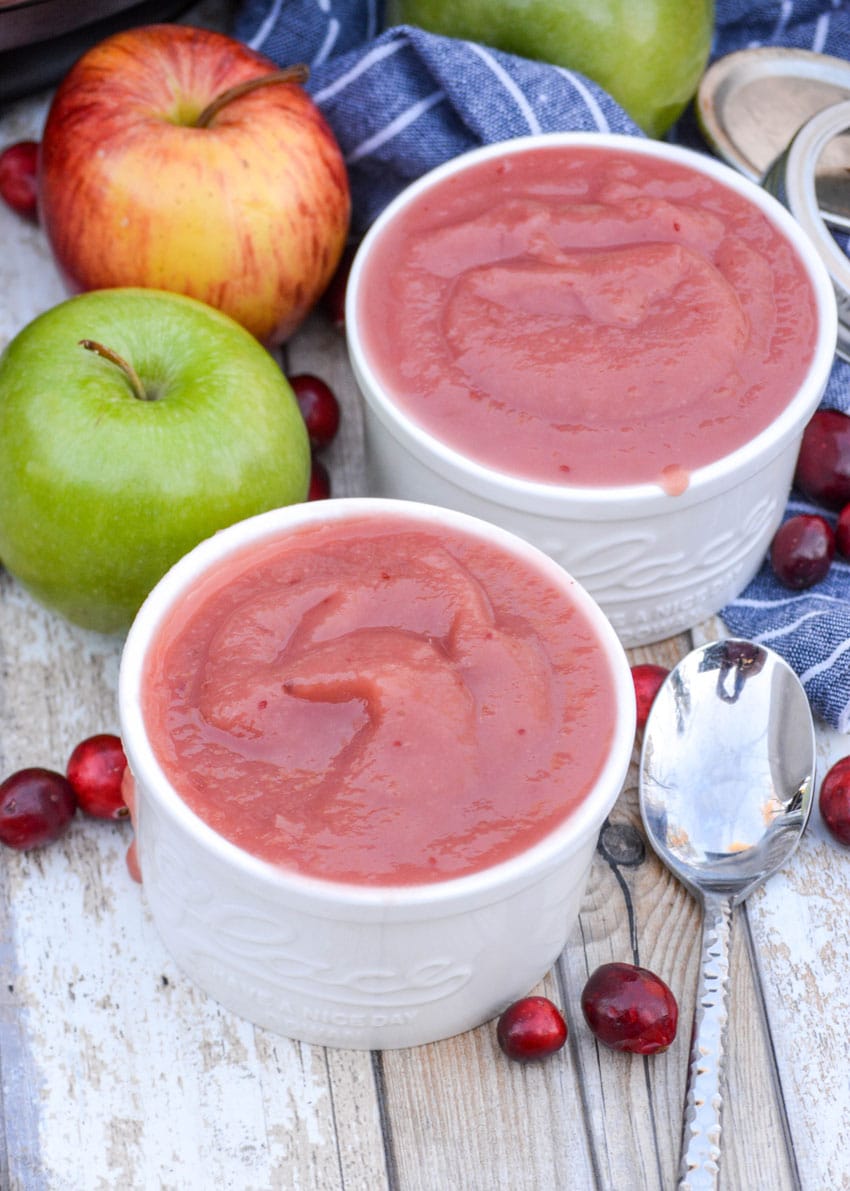 two white ramekins filled with instant pot cranberry applesauce