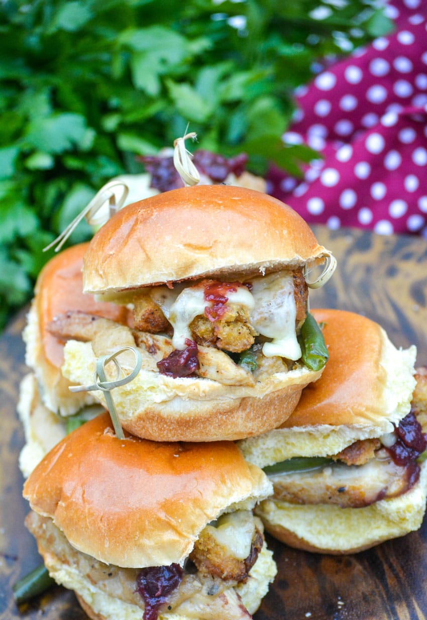 thanksgiving leftover sliders stacked together on a small wooden cutting board