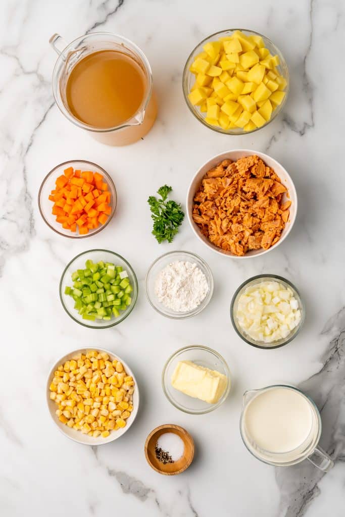 an overhead image showing the measured ingredients needed to make a batch of salmon chowder with canned salmon